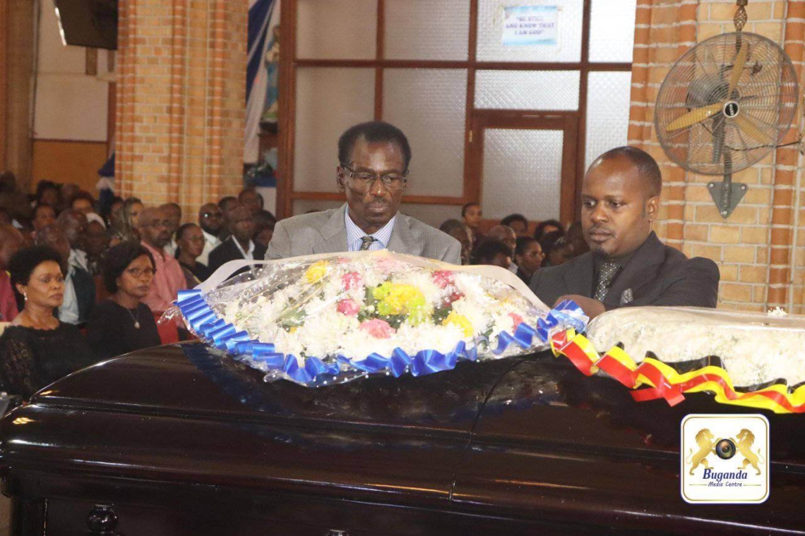 Owek. Israel Kazibwe Kitooke lays a wreath on the casket of the late Cedric Babu Ndilima Owek. Israel Kazibwe Kitooke lays a wreath on the casket of the late Cedric Babu Ndilima